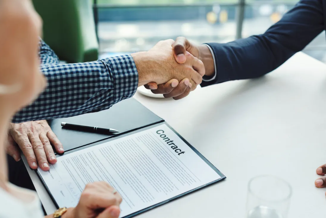 Handshake representing influencer outreach negotiation and contracts